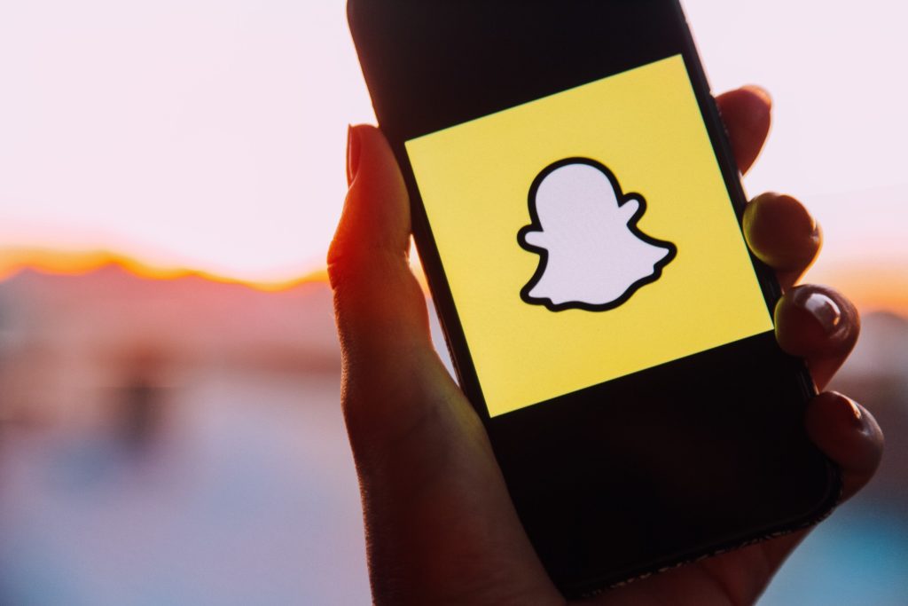 snapchat logo on a phone
